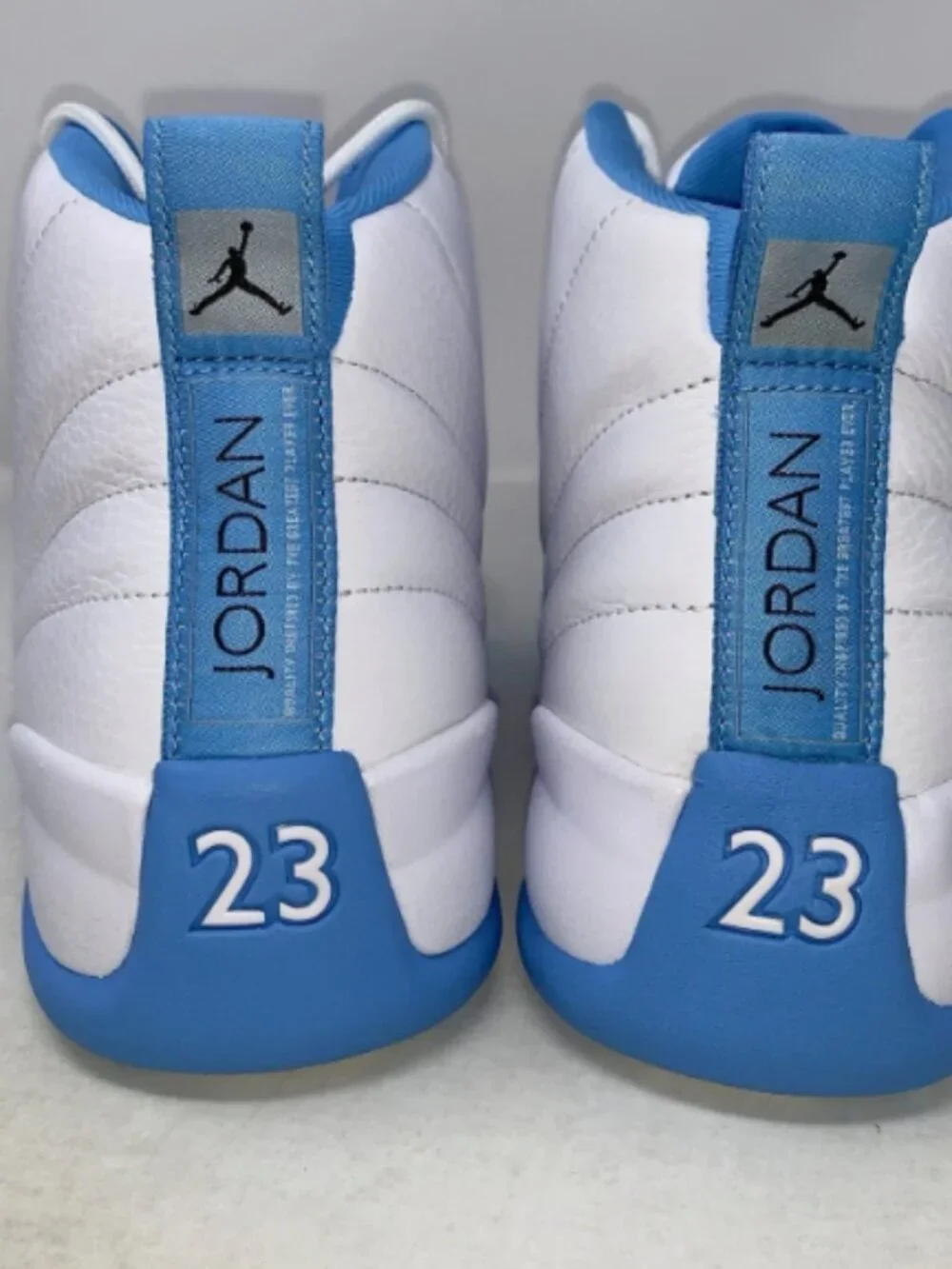 Air Jordan 12 'Melo UNC University Blue' White Sneakers